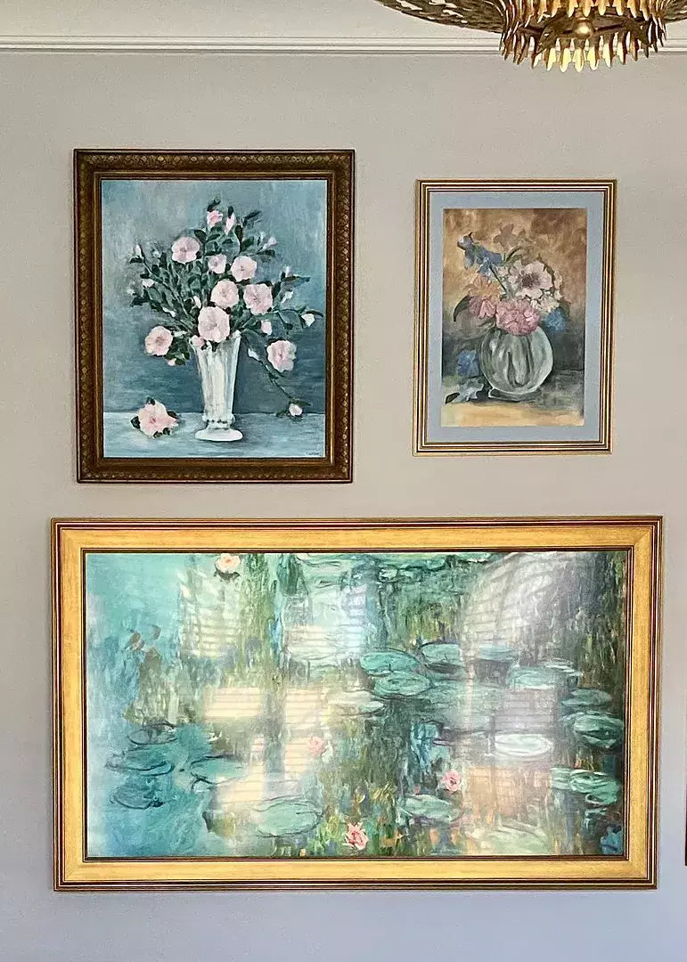 A Samsung Frame TV with two other art pieces make this TV wall a gallery wall.